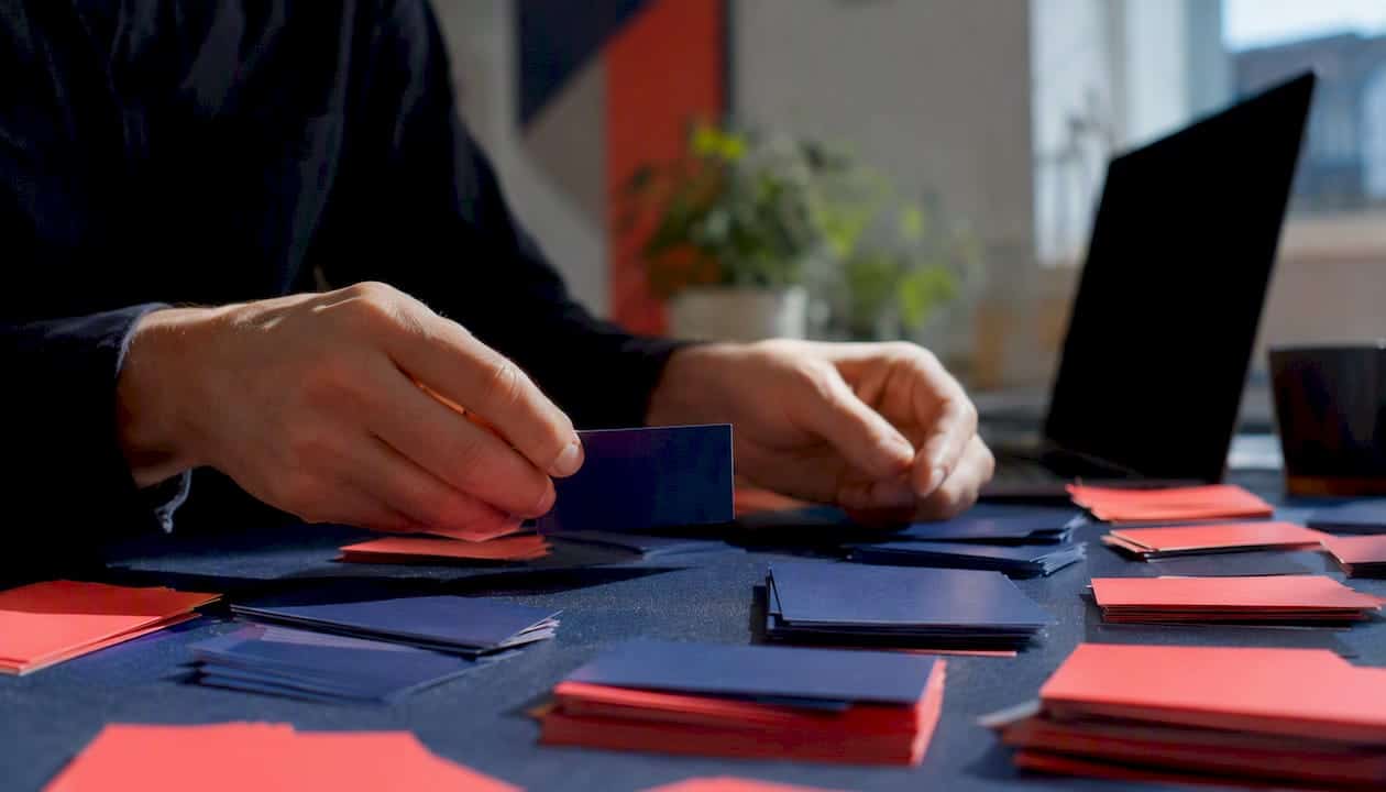 How to build a data-driven marketing strategy that works 2 • MB Brand Communications Hands sorting colour-coded data cards for hygiene